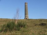 A winter view of the chimney with broom and silver birch